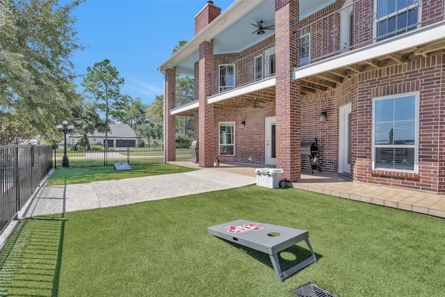 exterior space with ceiling fan and a patio