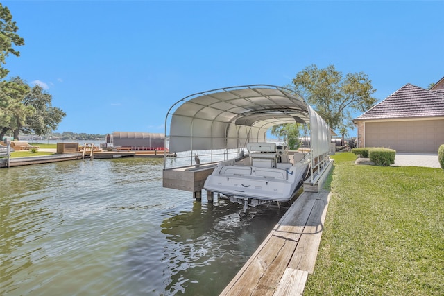 view of dock featuring boat lift, a water view, and a yard