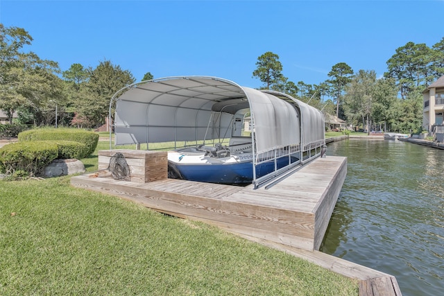 view of dock with a water view and a lawn