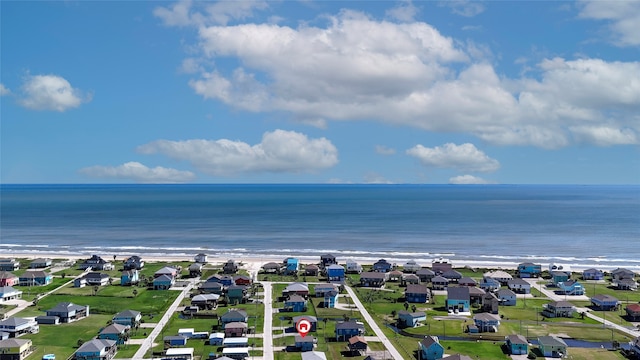 bird's eye view with a beach view and a water view