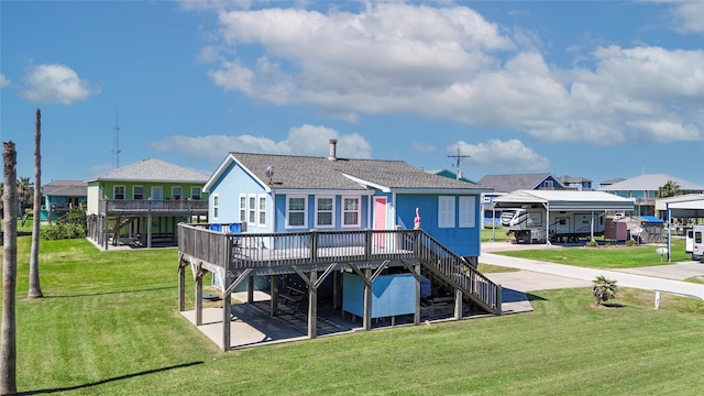 rear view of property with a lawn and a deck