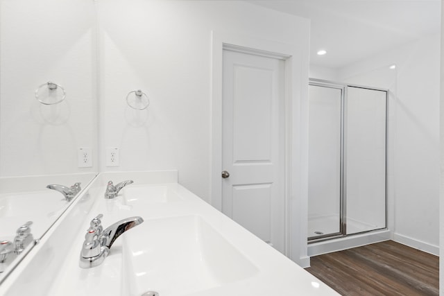 bathroom featuring vanity, hardwood / wood-style flooring, and an enclosed shower