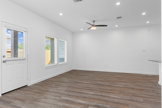 spare room featuring hardwood / wood-style flooring and ceiling fan