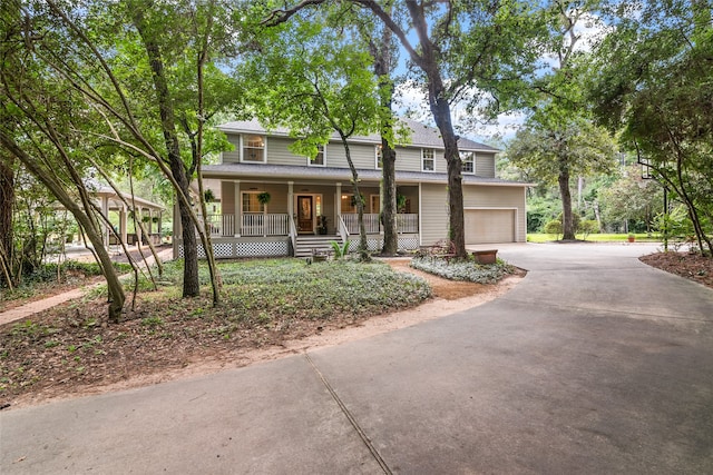 front facade with covered porch and a garage