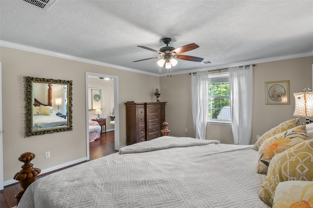 bedroom featuring ornamental molding, hardwood / wood-style flooring, and ceiling fan