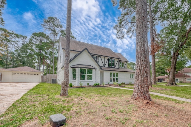 view of front of home featuring a front yard and cooling unit