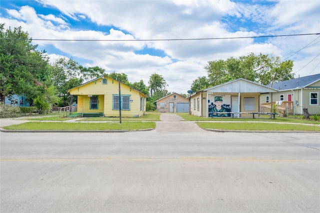 single story home featuring a garage and a front yard