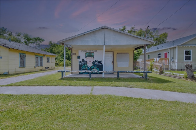 view of front of property with a yard