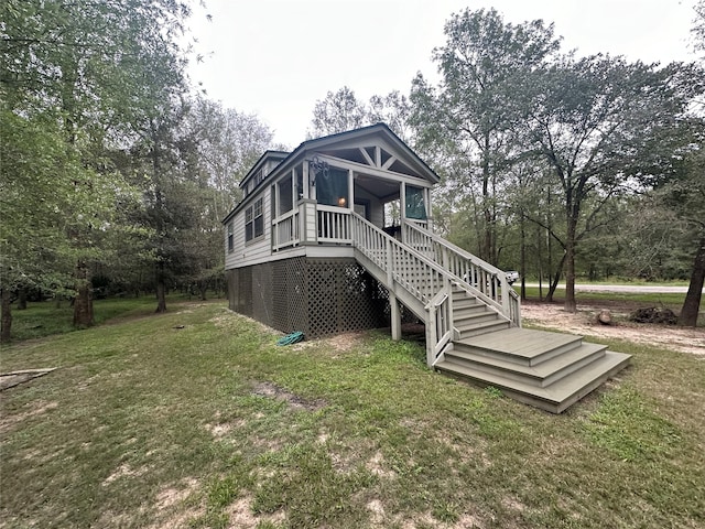 back of house with a yard