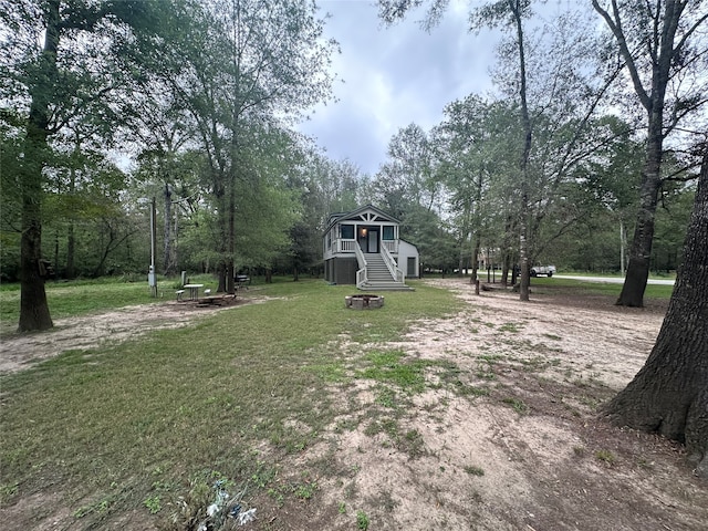 view of yard with a fire pit