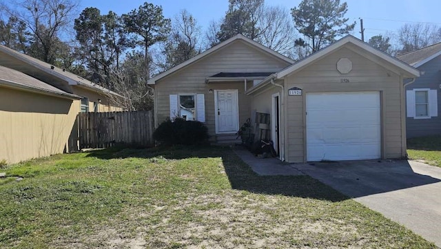 view of front of property with a garage and a front yard