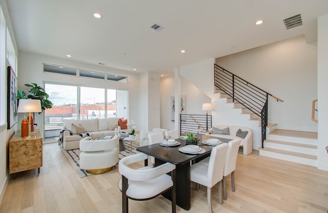 dining space featuring light wood-type flooring