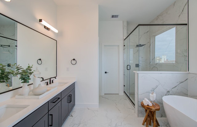 bathroom with vanity and independent shower and bath