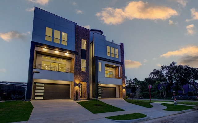 contemporary home with a balcony and a garage