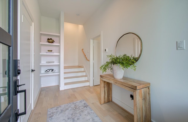 entryway with light hardwood / wood-style flooring