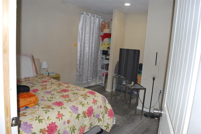 bedroom featuring dark hardwood / wood-style flooring