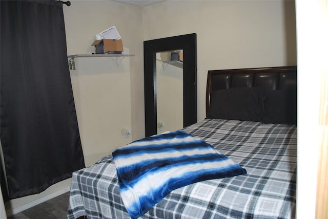 bedroom featuring wood-type flooring