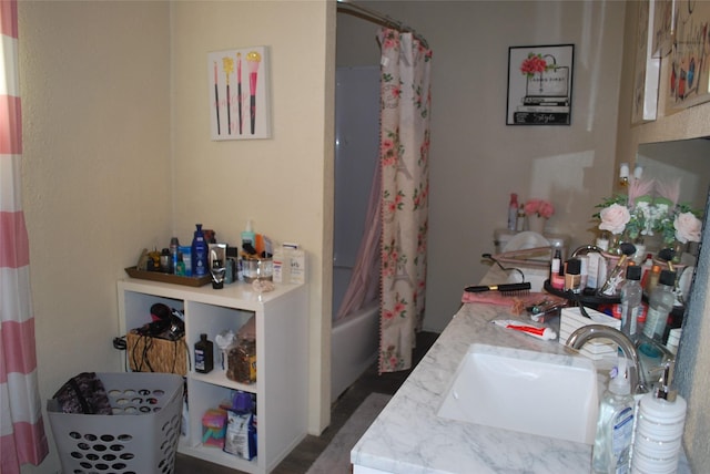 bathroom featuring vanity and shower / bath combo