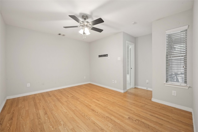 spare room featuring ceiling fan and light hardwood / wood-style floors