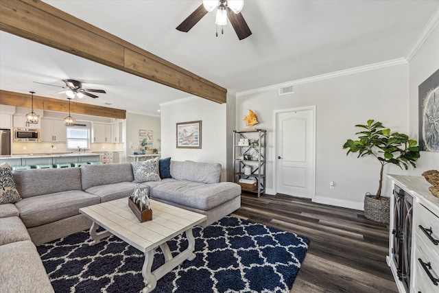 living room featuring beam ceiling, ceiling fan, ornamental molding, dark hardwood / wood-style floors, and sink