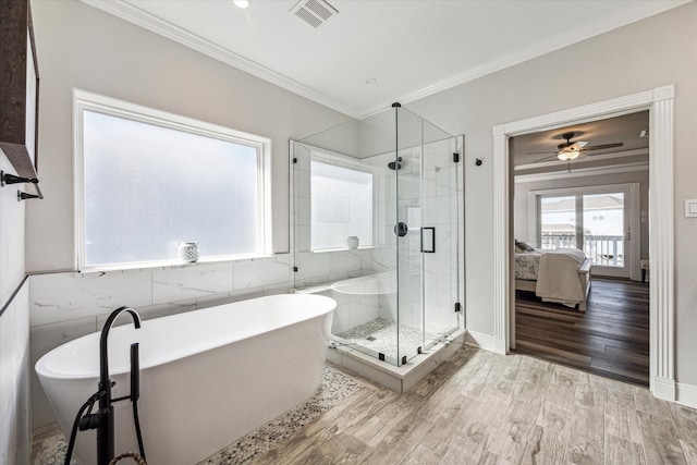 bathroom with independent shower and bath, tile walls, crown molding, and hardwood / wood-style floors