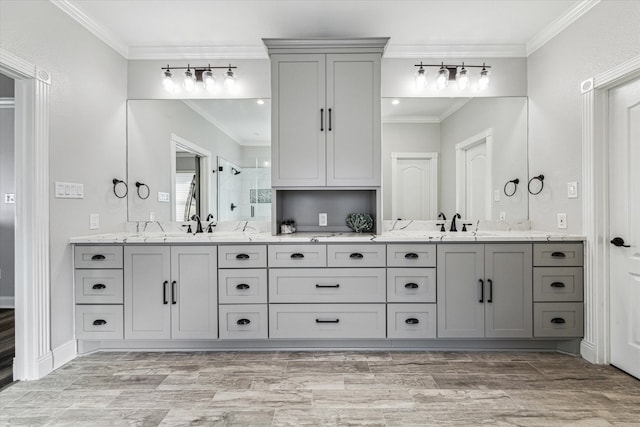 bathroom featuring walk in shower, crown molding, and vanity