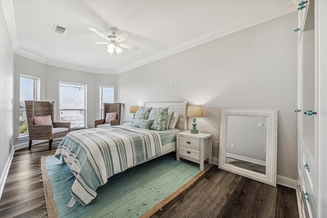 bedroom with ceiling fan, crown molding, and dark wood-type flooring