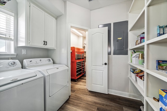 laundry area with cabinets, electric panel, dark hardwood / wood-style floors, and washer and dryer