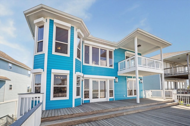 back of house featuring a wooden deck