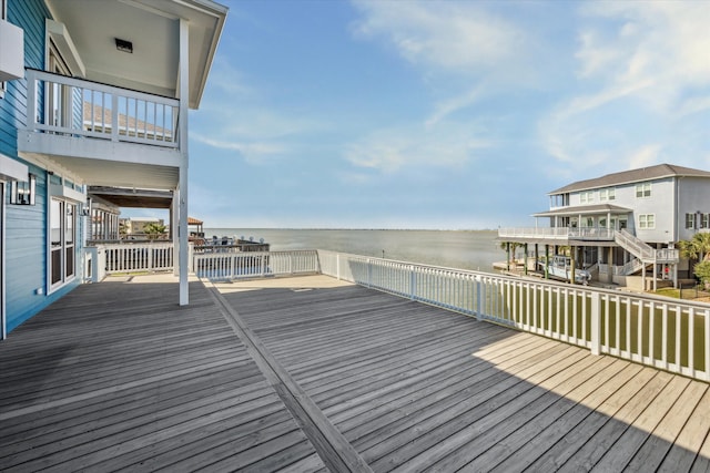 wooden deck featuring a water view