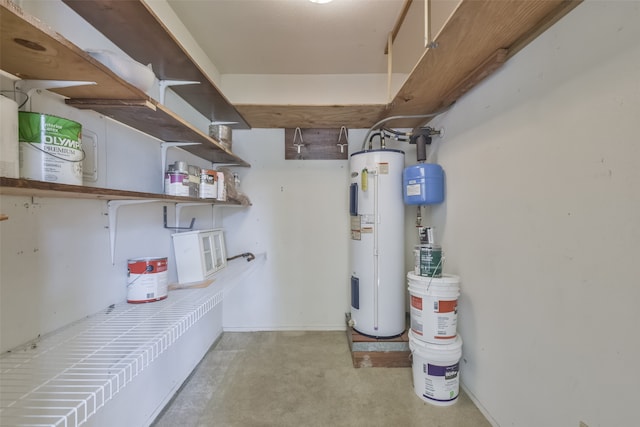 utility room featuring electric water heater