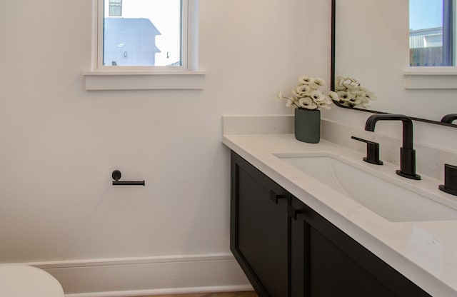 bathroom with vanity and toilet