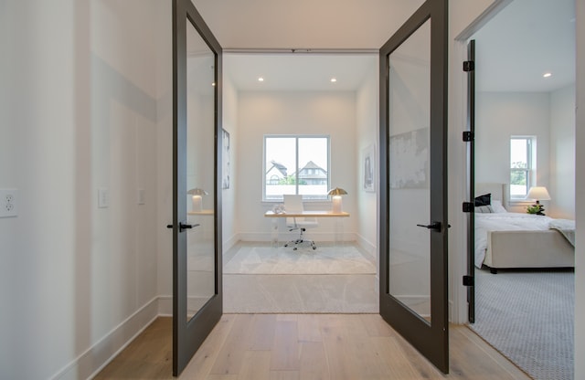 bathroom featuring french doors and hardwood / wood-style floors