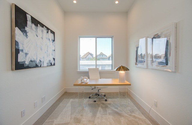 office space with light colored carpet