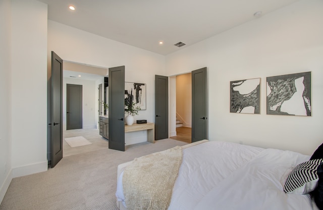 bedroom with light carpet