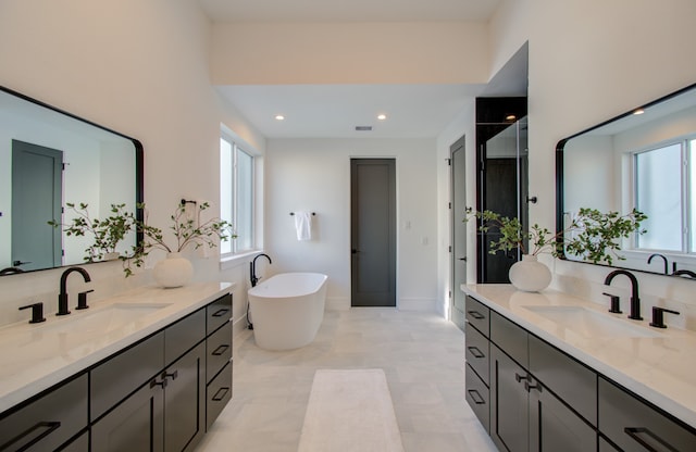 bathroom featuring plus walk in shower and vanity