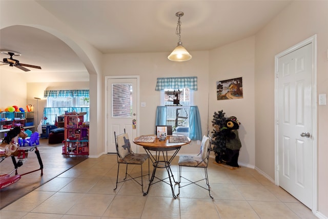 dining room featuring ceiling fan and light tile patterned floors