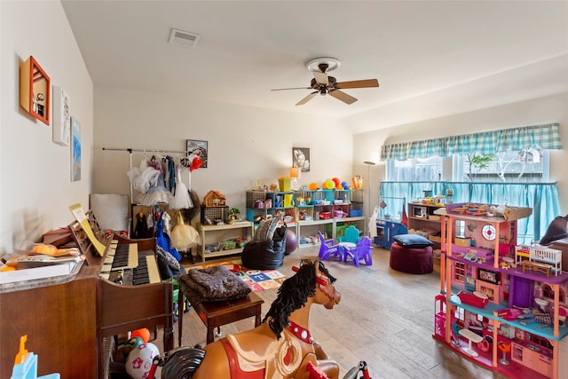 rec room featuring hardwood / wood-style floors and ceiling fan