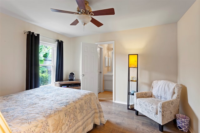 bedroom featuring hardwood / wood-style flooring, ensuite bathroom, and ceiling fan