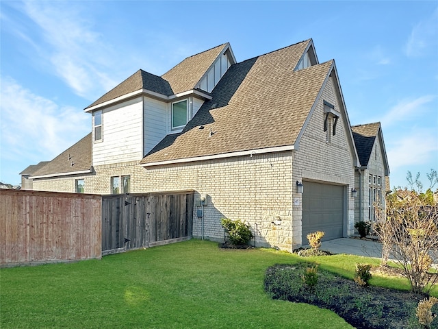 view of property exterior featuring a garage and a yard