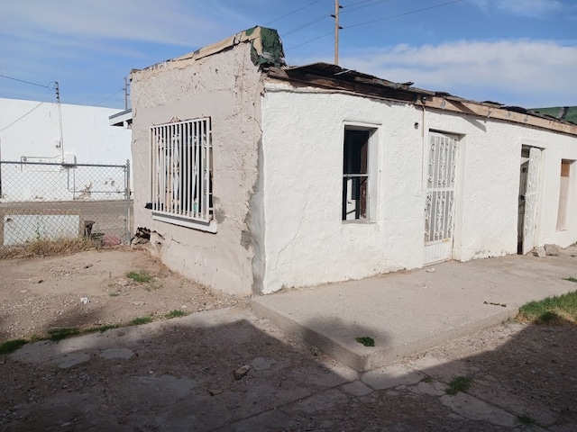 view of property exterior featuring a patio area