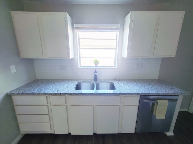 kitchen featuring stainless steel dishwasher, sink, white cabinets, and dark wood-type flooring