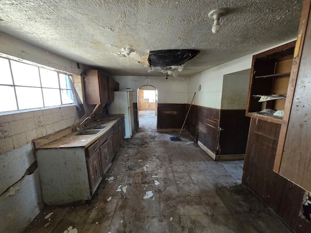 interior space with sink and white fridge