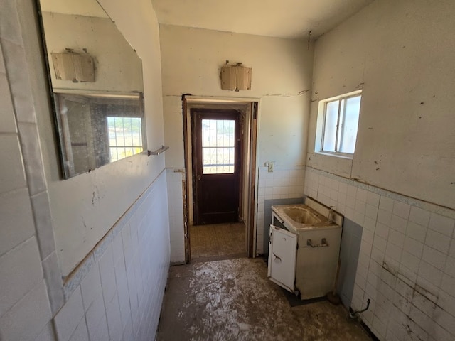 doorway to outside featuring sink