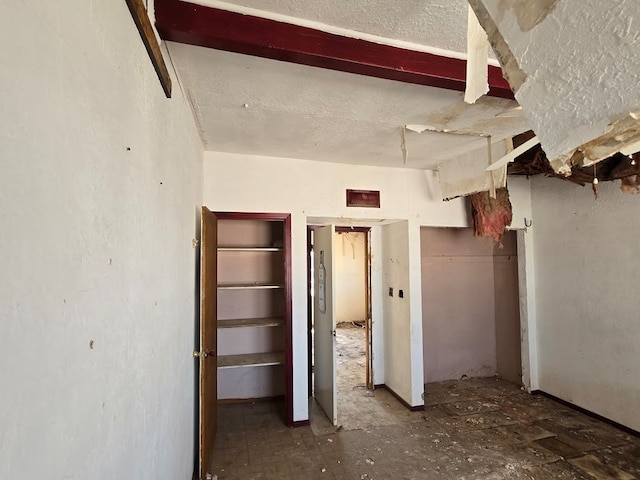 unfurnished bedroom with a textured ceiling