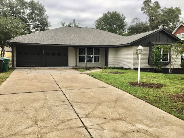 single story home with a front lawn and a garage