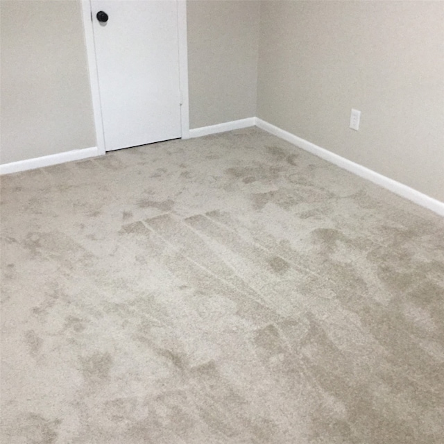 empty room featuring carpet flooring