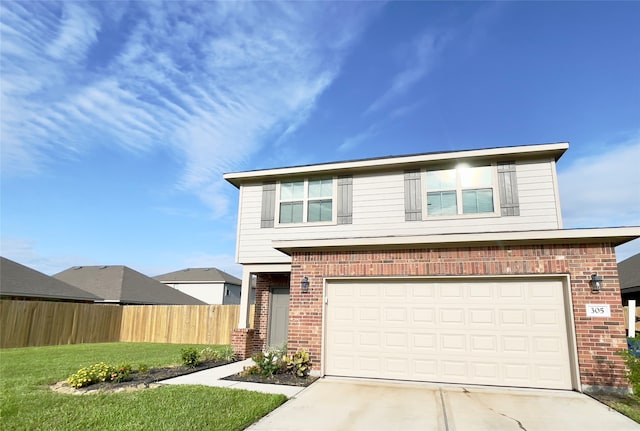 front of property featuring a front yard and a garage