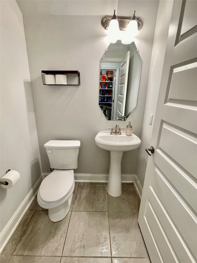 bathroom with toilet and sink