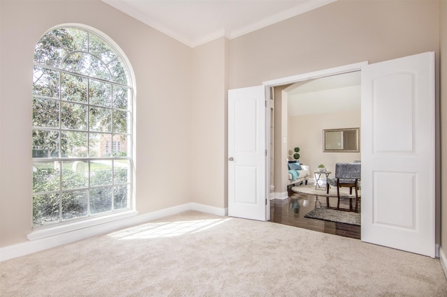 unfurnished room featuring hardwood / wood-style flooring and crown molding